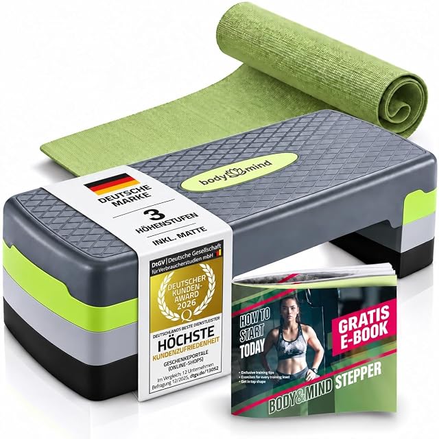 Tavola da step Body & Mind grigia e verde lime con un tappetino verde arrotolato, un e-book e un sigillo DtGV di premio dei clienti